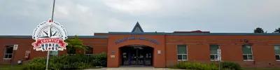 exterior picture of Courtice North Public School and their logo