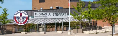 exterior picture of Thomas A. Stewart Secondary School and their logo