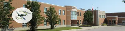 exterior picture of Harold Longworth Public School and their logo