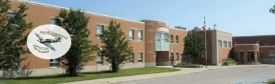 exterior picture of Harold Longworth Public School and their logo