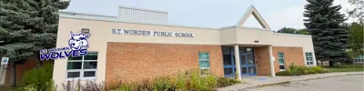 exterior picture of S.T. Worden Public School and their logo