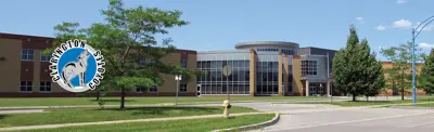 exterior picture of Clarington Central Secondary School and the school logo