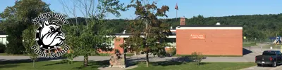 exterior picture of Spring Valley Public School and their logo