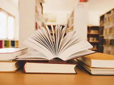 books on a table in a library