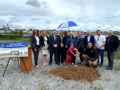 A group of people attending the sod turning of New Northglen School