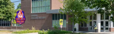 exterior picture of Cobourg Collegiate Institute and the school logo