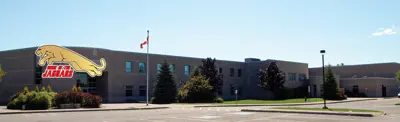 exterior picture of John M. James Public School and their logo