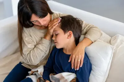 mother comforting a sick child