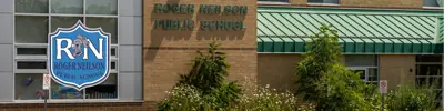 exterior picture of Roger Neilson Public School and their logo