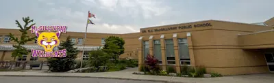 exterior picture of Dr. G.J. MacGillivray Public School and their logo