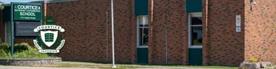 exterior picture of Courtice Intermediate School and their logo