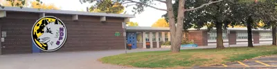 exterior picture of Norwood District Public School and their logo