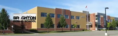 exterior picture of Brighton Public School and their logo